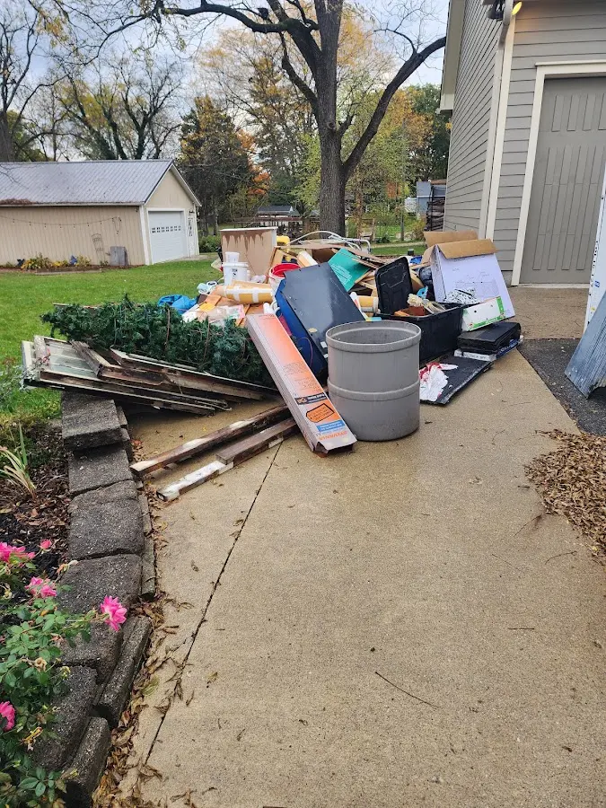 Dumpster being loaded with debris for 30 Yard Dumpster Rental in Grayson